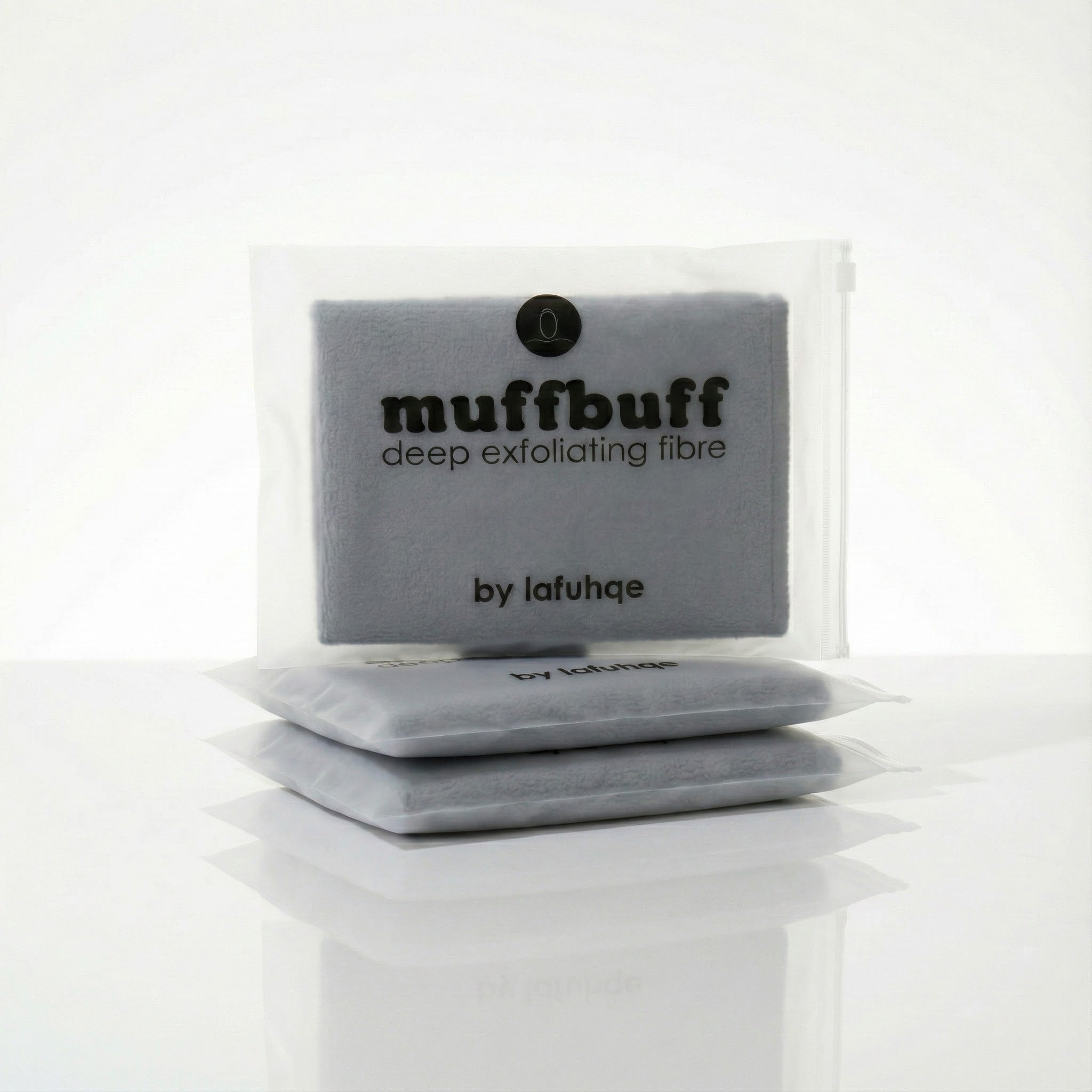 Gray exfoliating scrubber with 'muffbuff' branding on a white background