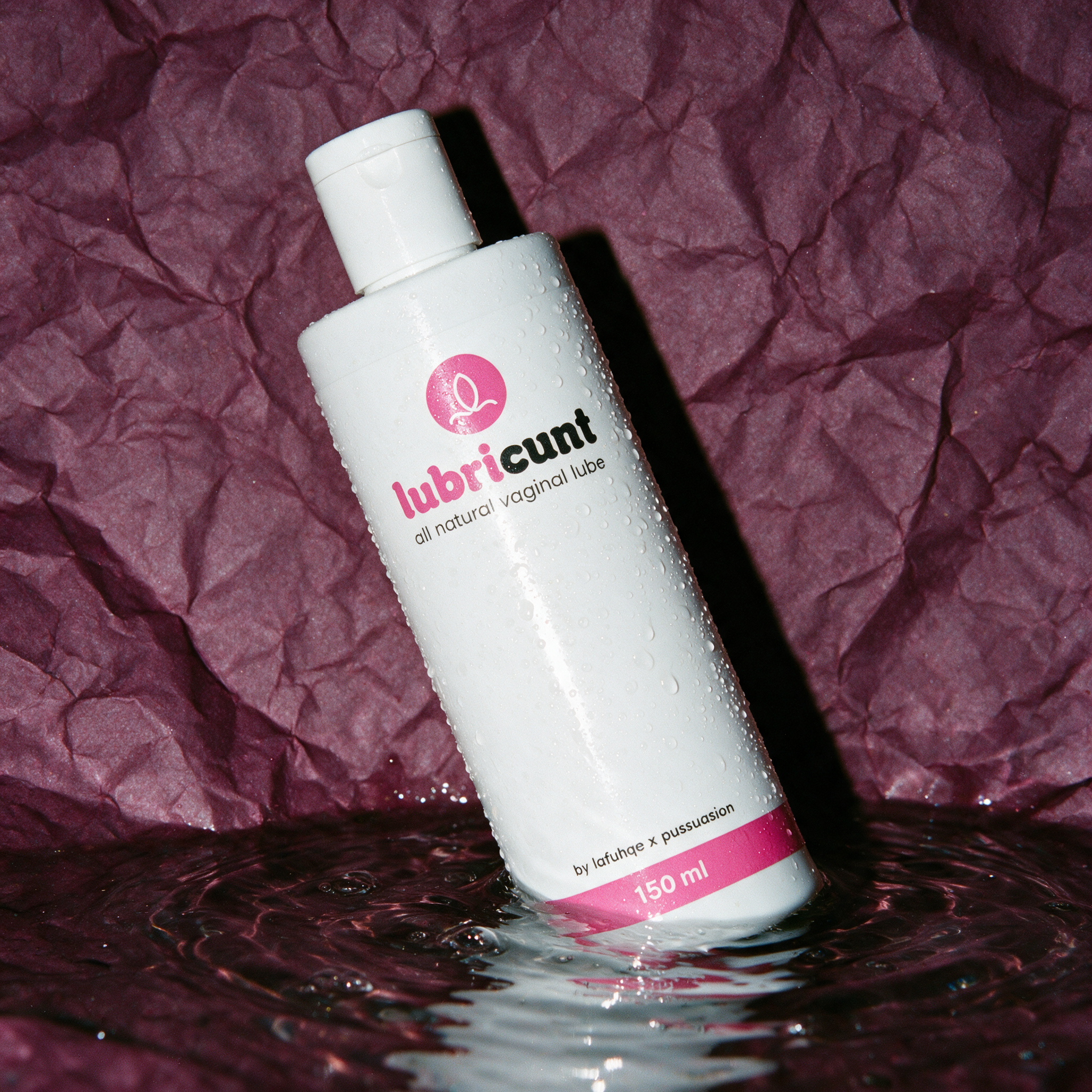 Lubricunt water-based personal lubricant photographed on wine plum backdrop