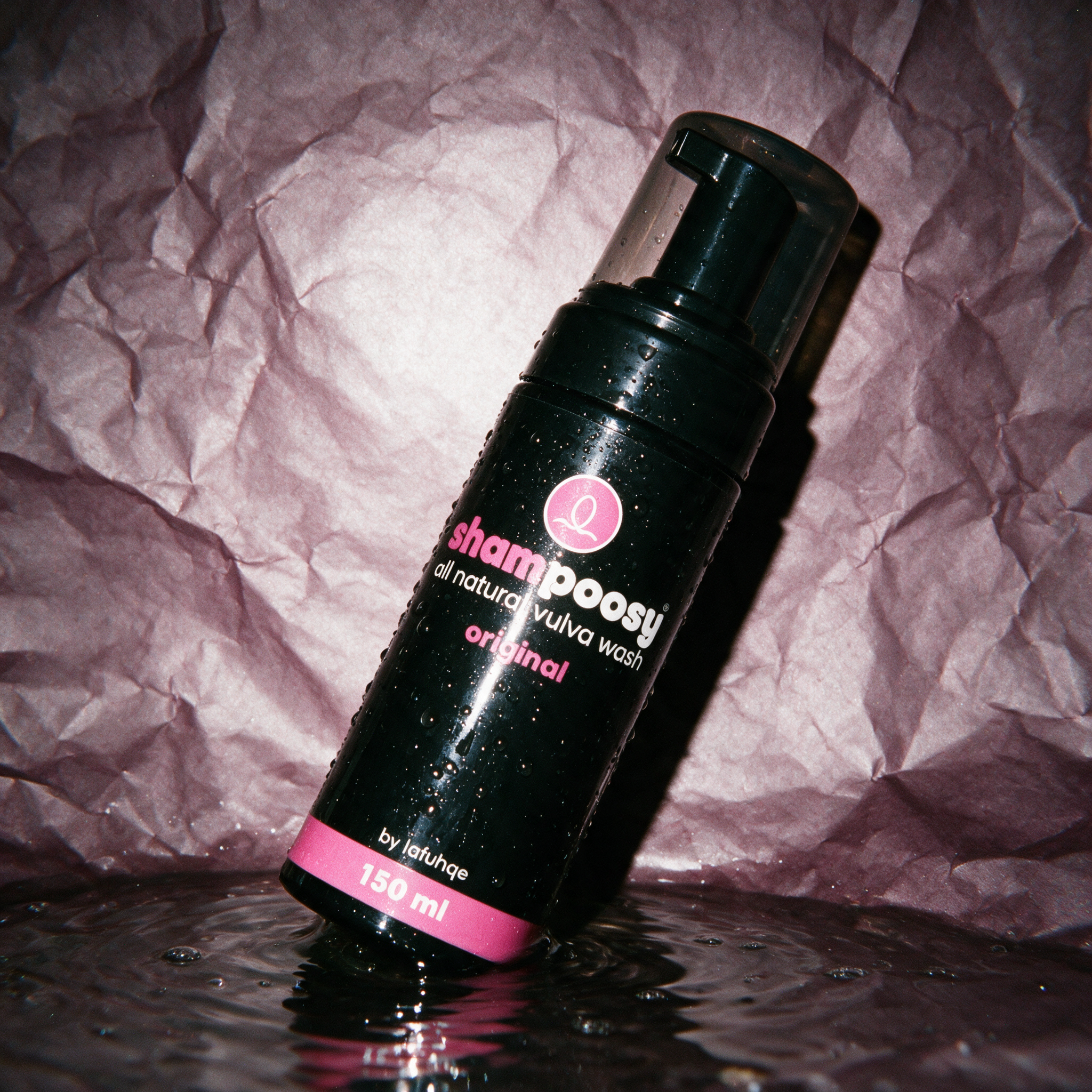 Shampoosy original vulva wash photographed on dark mauve plum backdrop