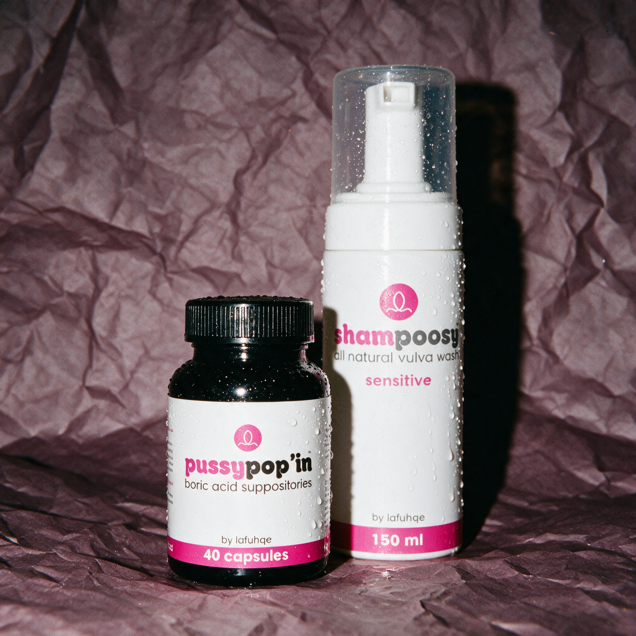 PoosyPop'in and Shampoosy odour control combo photographed on dark mauve plum backdrop
