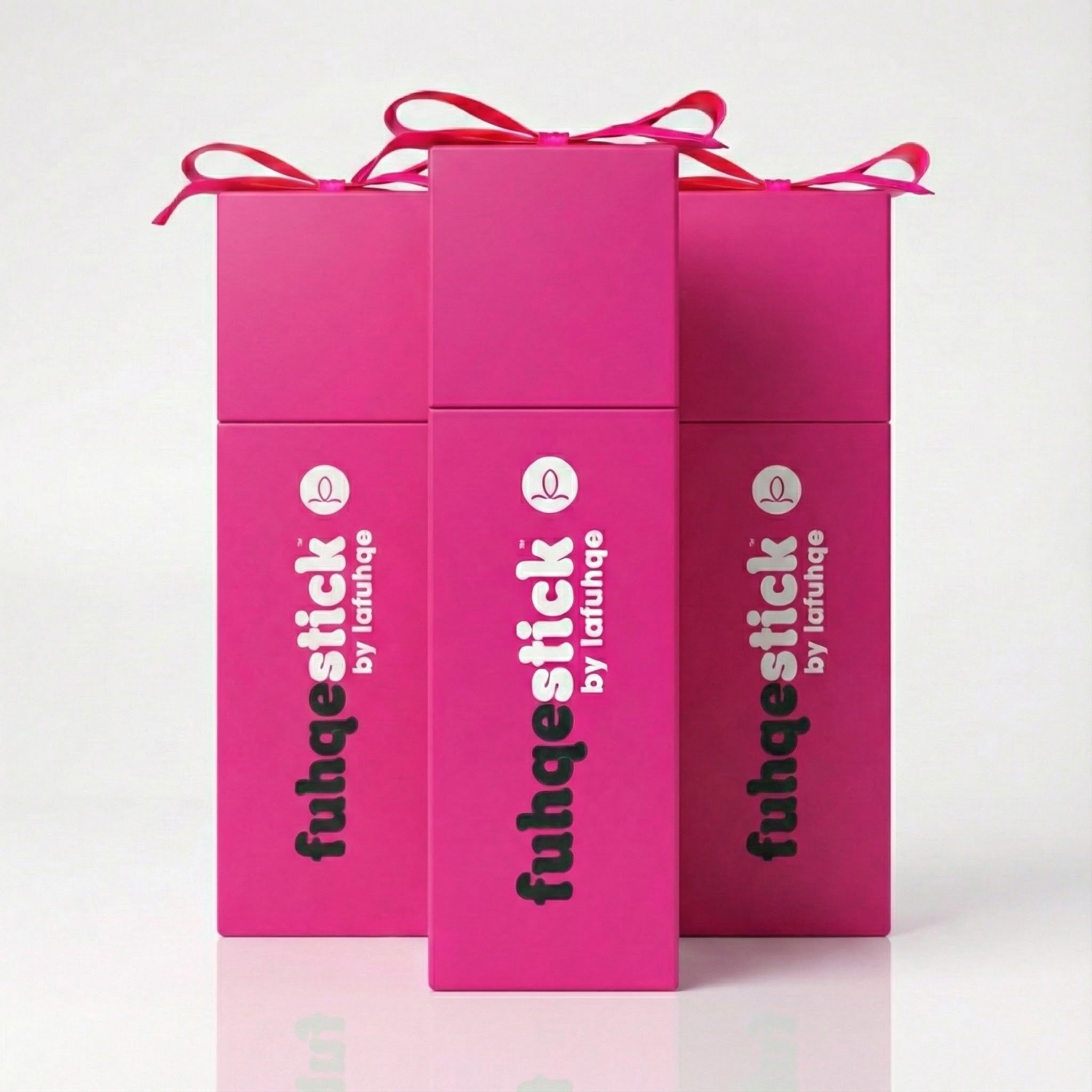 Three pink boxes with 'fuhqestick by fuhque' branding on a white background