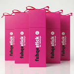 Pink packaging boxes with 'fuhqestick by lafuhqe' branding on a light pink background